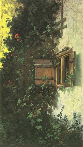 Hauswand mit Stallfenster und mit Rosen beranktem Spalier